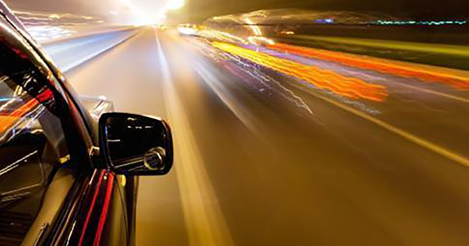 view of dashboard of a car at a high speed